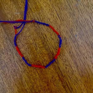 This is a purple and red bracelet.It’s homemade